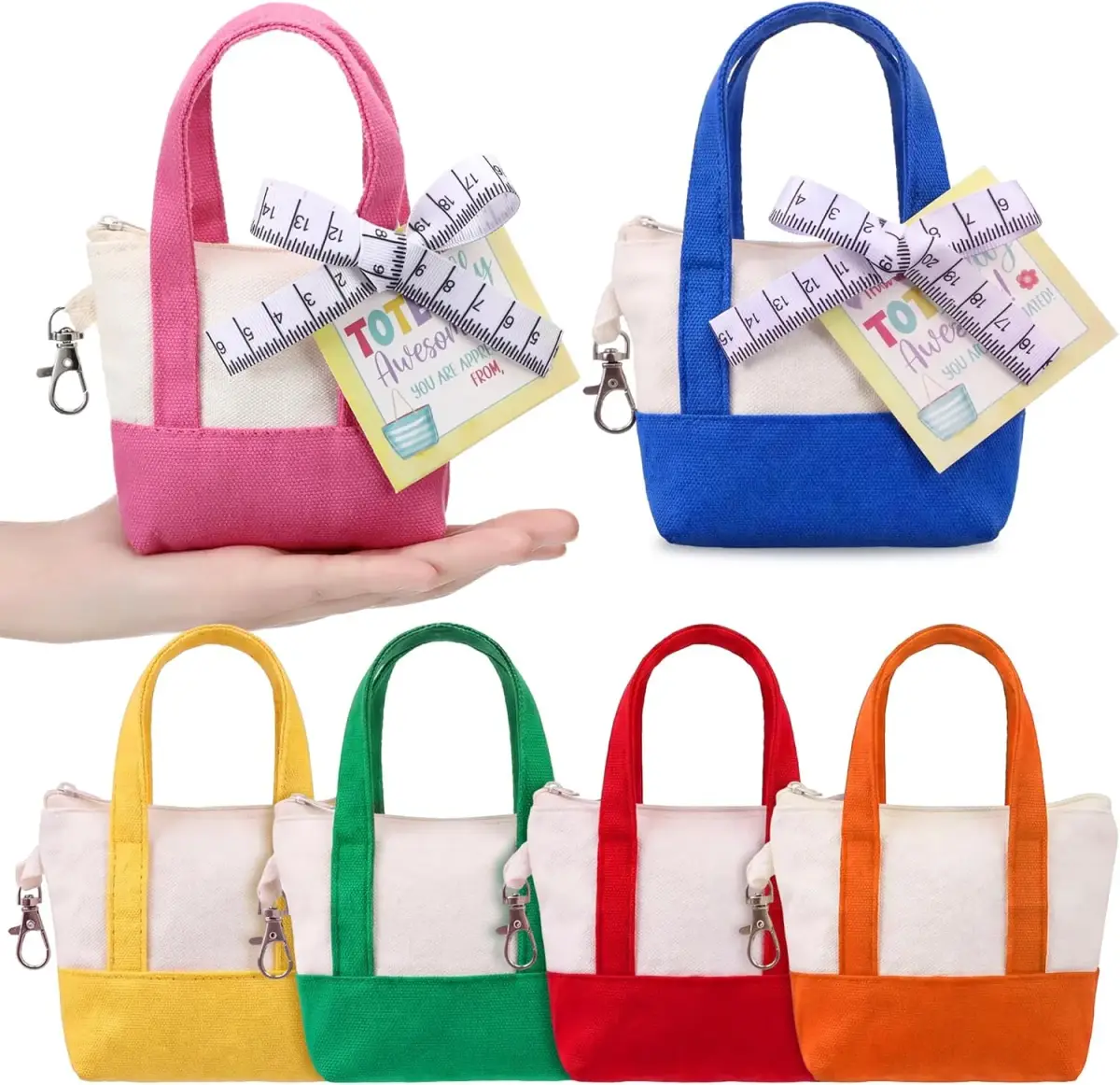 Colorful miniature tote bags in pink, blue, yellow, green, red, and orange, with measuring-tape tags; a hand shows their small size.