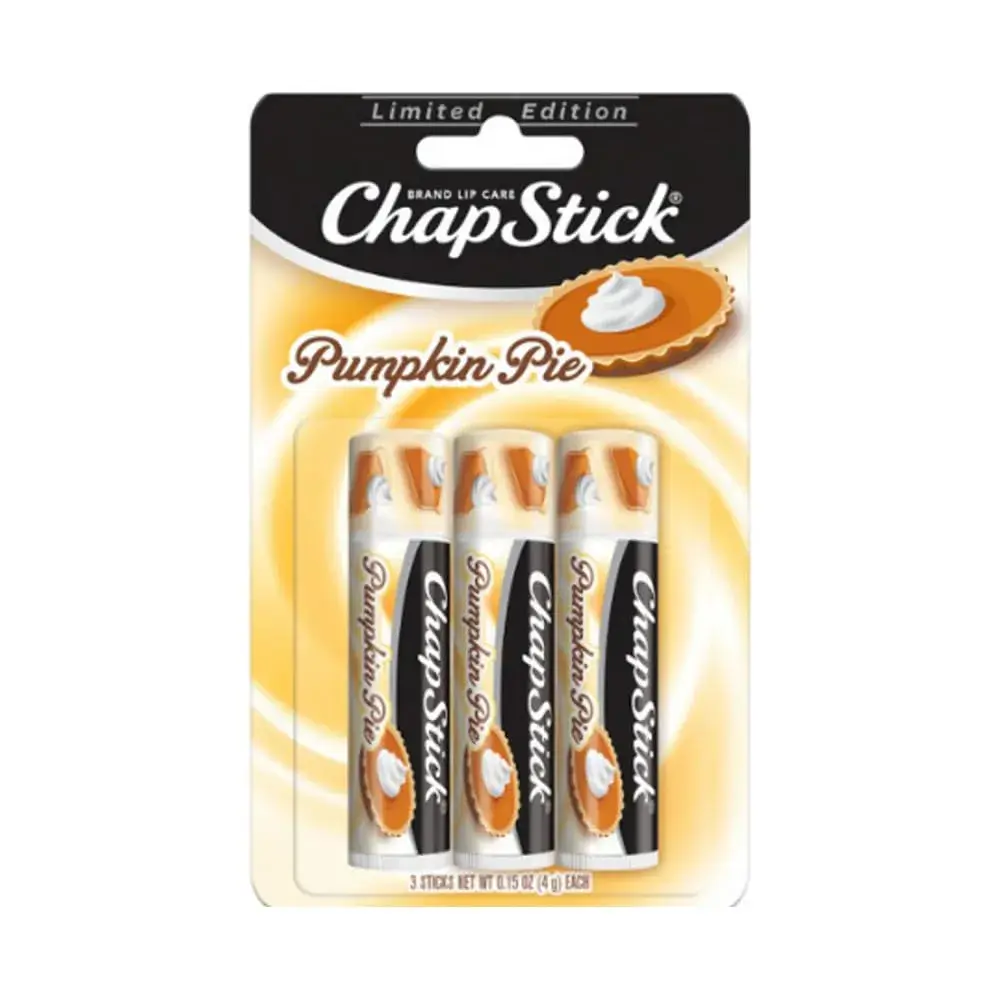 Limited-edition ChapStick Pumpkin Pie lip balm three-pack in yellow packaging, featuring pumpkin pie and whipped cream imagery; cozy fall theme.